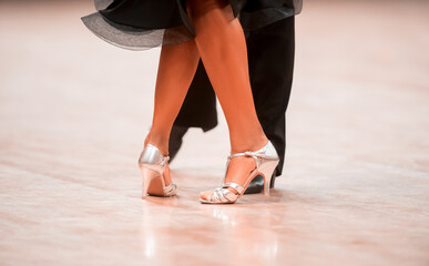 Man and woman dancer latino international dancing.  Ballroom dancing is a team sport. Vintage color filter..