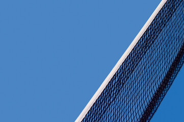 Blue paddle tennis net and hard court. Tennis compettion concept