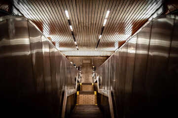 Manhattan, New York, USA - May 10, 2020.
An entrance to 63rd Street subway station on Manhattan, NYC.  View of the escalators and stairs.