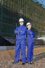 The Young Engineers working at construction field 