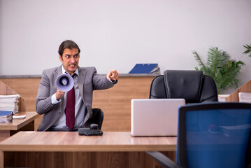 Fototapeta na wymiar Young businessman employee in bullying concept in the office