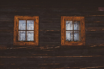 Close up shot of old wooden hut window.Vlkolinec,traditional settlement village in the mountains.