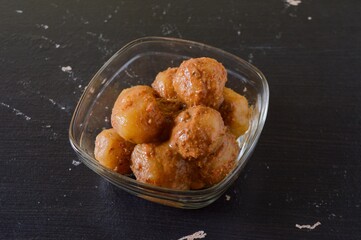 Cilok is balls prepared with a base of tapioca flour. Whether boiled or fried, cilok balls are typically accompanied by a sweet peanut sauce or spicy sauces based on ketchup and kecap manis.