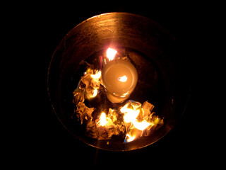 burning candle in the dark