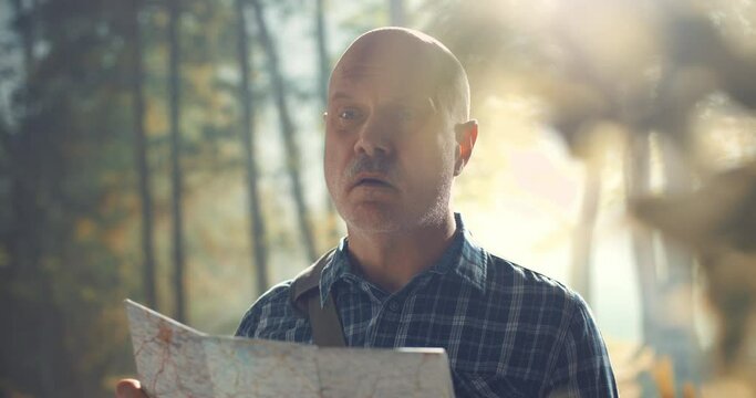 Lost tourist checking his location on a map