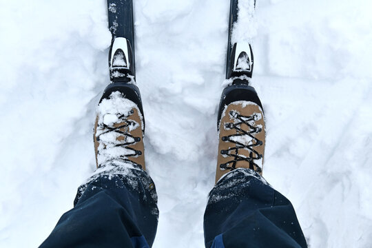 Cross Country Ski boots with bindings and skis in snow