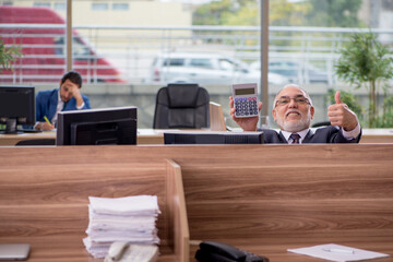 Two businessmen employees working in the office