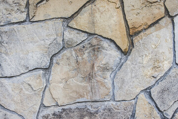 Closeup of a stone wall at daytime - perfect for wallpapers and textures