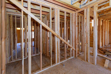 House under construction of wooden beams at construction the roof of air conditioner vents
