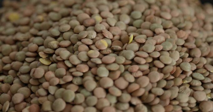 Pile of green lentils rotating Close-up shoot