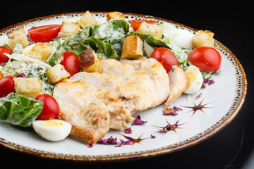 Caesar salad with lettuce, cherry tomatoes, quail eggs and crispy rye croutons