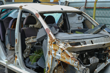 Close up of crashed car  in preparation of repair work, Make the surface of the car smooth ,preparing for repairing and painting at station service