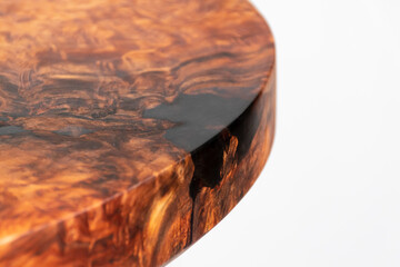 Finished redwood circular wooden slab with black epoxy resin. Old growth redwood burl.