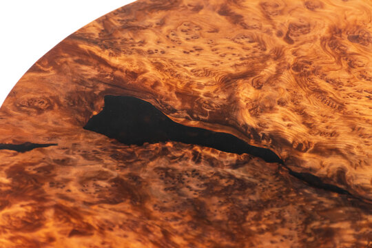 Finished redwood circular wooden slab with black epoxy resin. Old growth redwood burl.