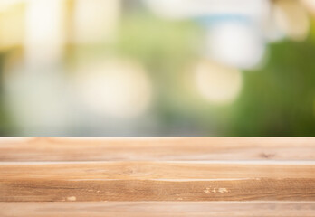 Wooden surface on a blurred natural background