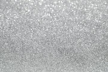 Blurred silver glitter and bokeh background. Abstract texture background.