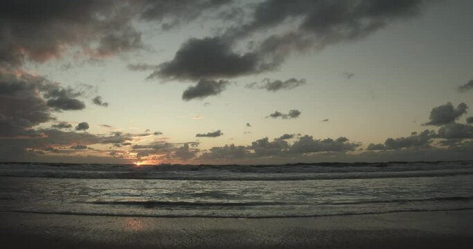 Waves in front of a beautiful sunset on Sylt