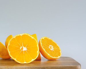 Piece of orange on cutting board