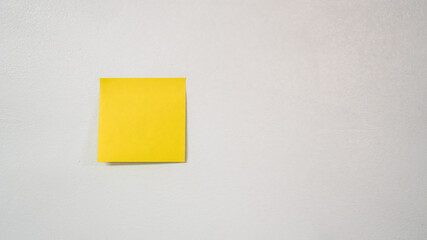 yellow sticky note on wall