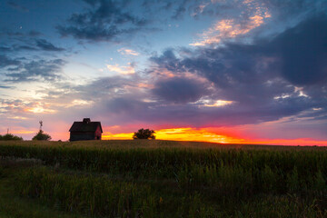 Old weathered barn at sunset
