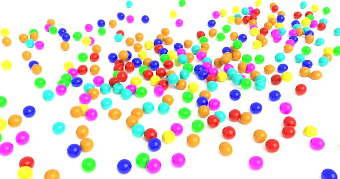 Colored rubber balls fall on a white surface 4k