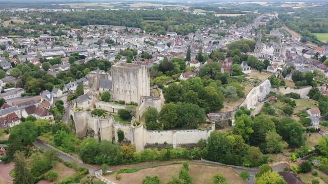 Scenic drone view of medieval fortified castle with royal residence and St Ours church in historic French town of Loches in summer