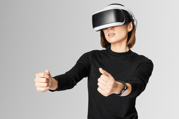 Woman with VR playing racing game