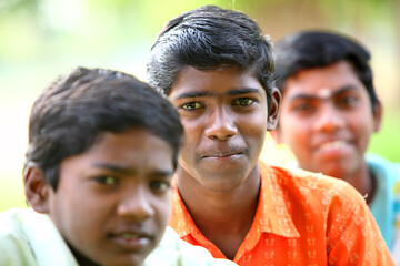 Group of Indian happy teen boys looking at the camera.