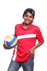 Cheerful Indian teen with volley ball.