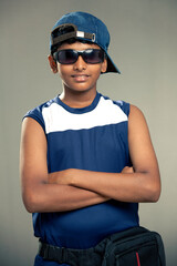 Cheerful Indian teen with sunglass with cap