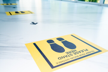 Social Distancing concept, People standing and waling distance of 1 meter from other people keep distance protect from COVID-19 viruses, Social Distancing Floor Sticker.