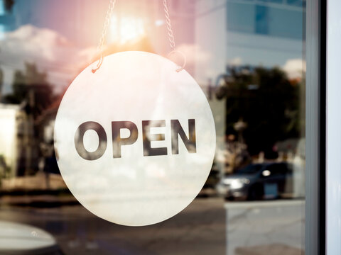 Open sign hanging on the glass door.
