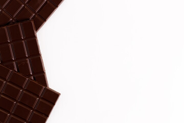 Dark chocolate bars on white background