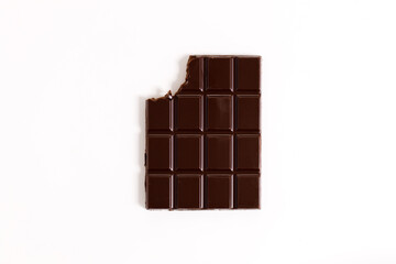 Chocolate bar with teeth bite on white background