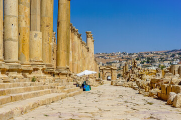 Jordan, the ruins of Jerrash (Gerasa). 
Old man is visiting and walking in the colonnaded street. 