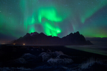 Vestrahorn and its black sand beach in Iceland.Sand dunes on the Stokksnes on southeastern Icelandic coast with Vestrahorn (Batman Mountain). Iceland, Europe.