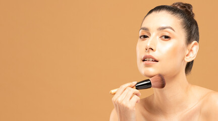 Beauty asian woman hold make up brush  and cheerful with make up brush