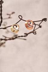 Handmade copper earrings in the shape of a shell on a white background. Jewelry product. Special gifts                                 
