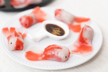 Beautiful steamed crystal dumpling in Koi fish shape, Chinese and Japanese food art