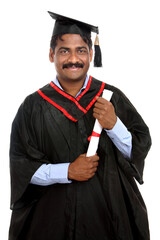 Cheerful Indian graduate on white background.