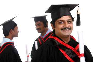 Indian graduates isolated on white background.