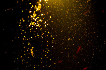 Gold bokeh blur defocus in black backgeound