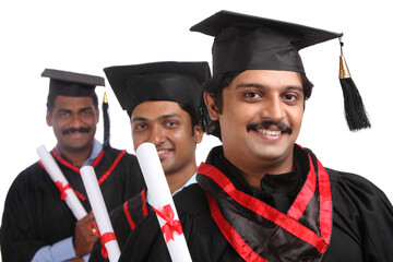 Indian graduates isolated on white background.