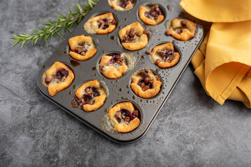 Brie bites with jam and nuts in crescent dough, mini appetizer dessert with cranberry or any jelly © Tanya