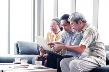 asian retired video call with their friends on mobile device