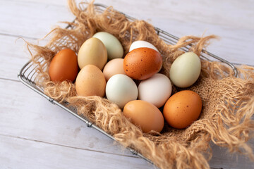 Fresh eggs from free range chickens on a small farm, beautiful colorful eggs from different breeds of chickens
