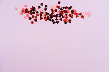 Red and pink hearts on a pink background on Valentine's Day