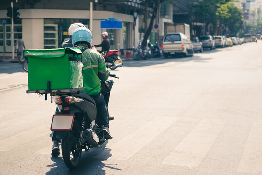 Food Delivery Drivers Are Driving To Deliver Products To Customers Who Order Online. Impact Of Epidemics