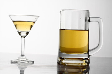 Glasses of alcohol drinks on white background.