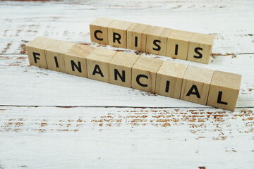 Financial Crisis Word alphabet letters on wooden background